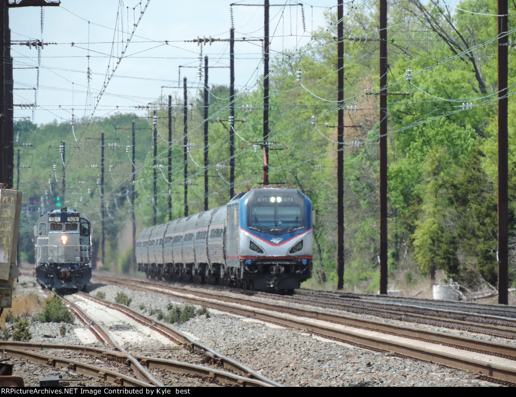 train 184 passing work train